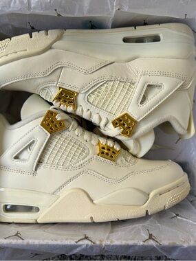 Jordan Retro 4 Sneakers in Sail with Gold Accents
